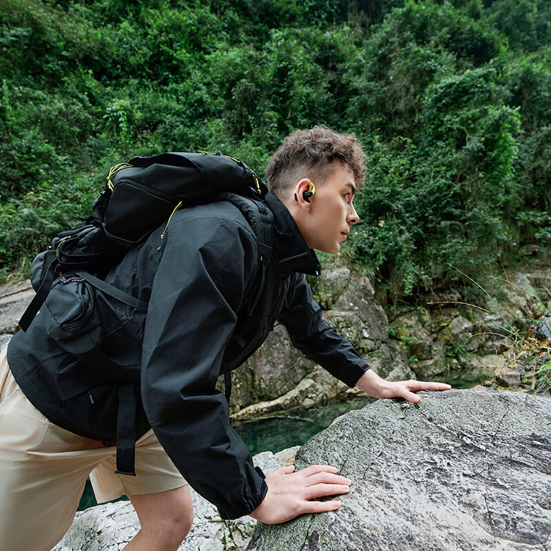 A Man climbing with AirFit earbuds