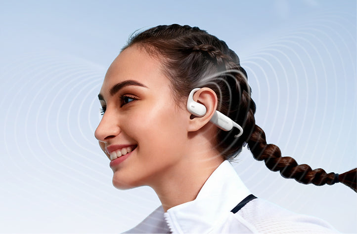 Runners wearing AirWave Pro2 open-ear headphones while talking during a run